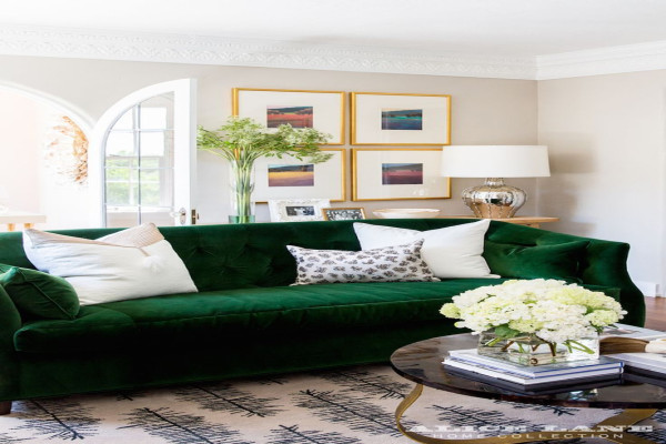 Check out our yummy green velvet sofa with white pillows recently