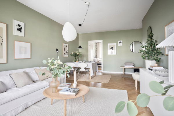 Home tour: Minimalist living room with sage green walls - COCO