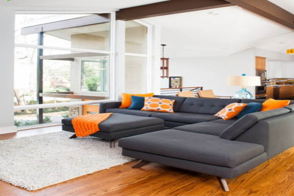 Mid Century Modern Living Room with Grey, Orange, and White Accents